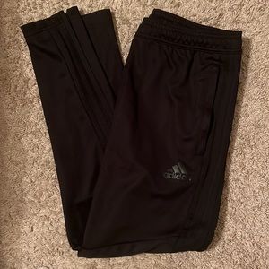 black Adidas track pants; black with black stripes; M